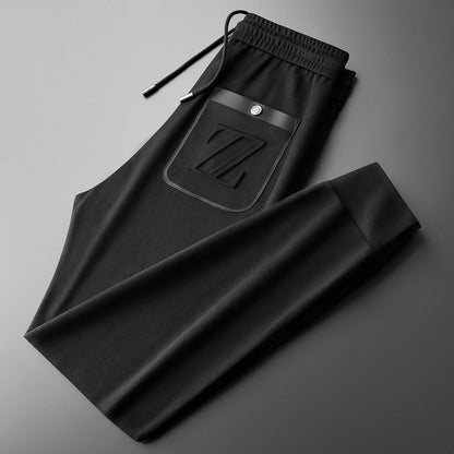 Moda Elite | Sportowe spodnie dresowe z haftem